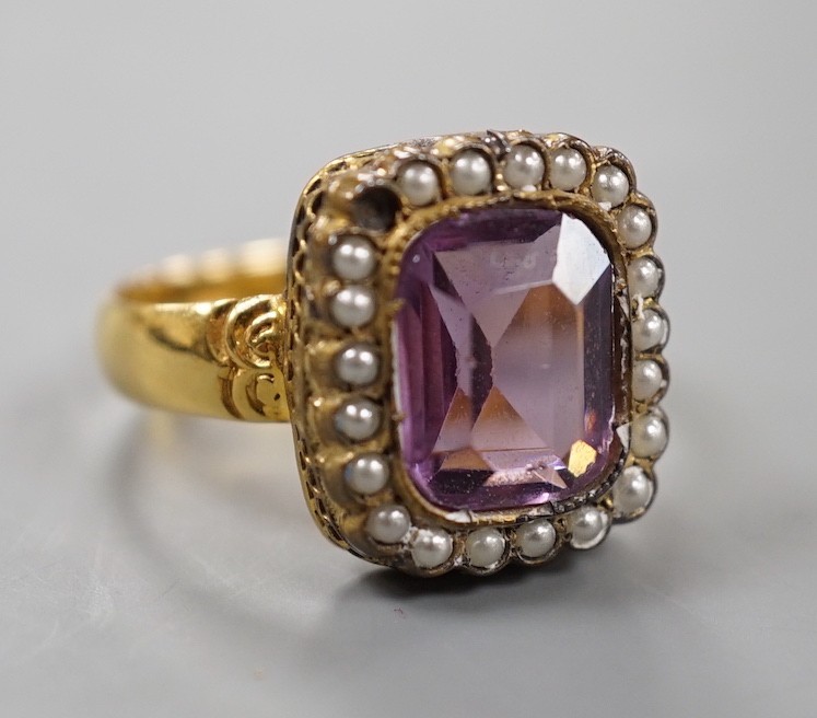 A Victorian 18ct gold, amethyst paste and simulated split pearl cluster set dress ring, size M, gross weight 4.5 grams.